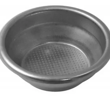 A round, metal filter basket with a perforated bottom, like the Ascaso I..535 2 cup Filter Basket/Cup designed for the Ascaso Steel Professional espresso machine. © 2025 1st-line.com