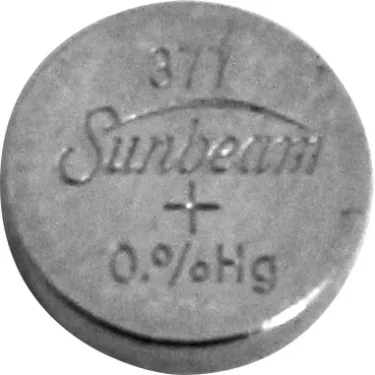 A round silver Elektra 02649035 battery with 0% Hg, designed for Nivola Clock devices. © 2025 1st-line.com