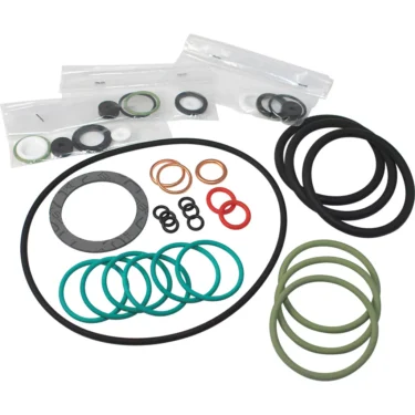 Assorted O-rings and seals from the Elektra 03082034 Gasket Kit for Extramaxi 3 group models 97, in black, green, red, and copper—some in clear bags—arranged on a white background. © 2025 1st-line.com