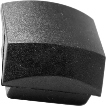 Close-up of a single black plastic computer keycap at an angle on a white background, featuring the Bezzera 5473002.01 Bottom Vibration Damper. © 2025 1st-line.com