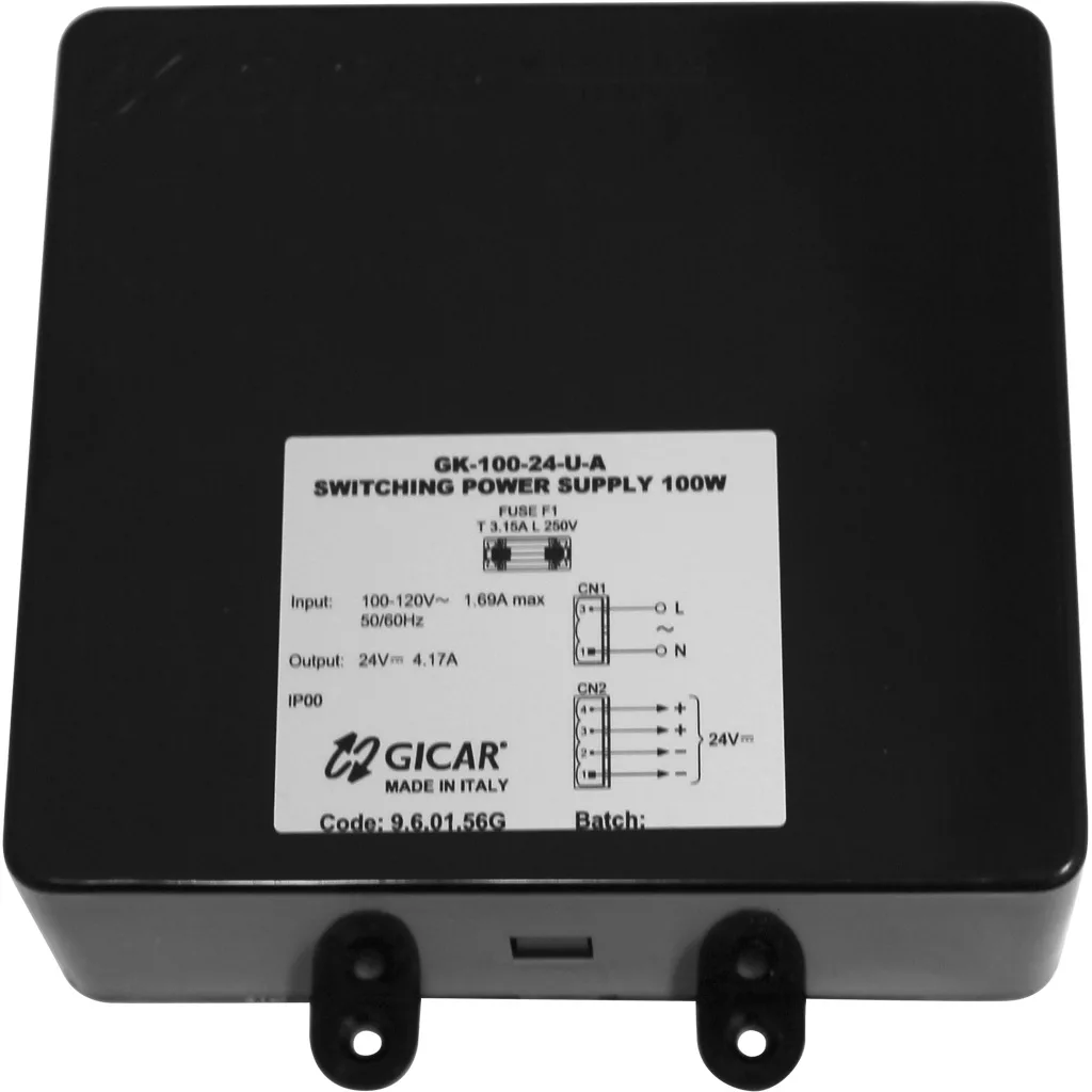 The Ambiente VES1035 Espresso Transformer (110V to 24V, Brain Unit/Control Board 9.6.01.56G, Gicar) is a rectangular black unit with a white specs label and two bottom mounting tabs, designed for Vesuvius espresso machines. © 2025 1st-line.com