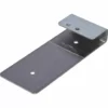 The Ascaso I.2442 Pump Support Plate is a flat metal bracket featuring two holes on the larger base and two smaller holes on the raised, bent end for secure screw attachment. © 2025 1st-line.com
