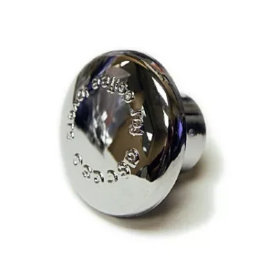 The Ascaso I..271 Cap for portafilter handle is a shiny, round metallic knob with engraved text, designed exclusively as a handle cover for Ascaso Steel Professional espresso machines. © 2025 1st-line.com