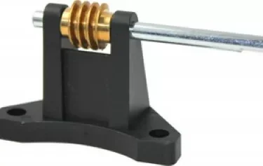 The Ascaso MI.116 Stepless Worm Gear Drive Assembly features a brass coil, steel shaft, and mounts easily on a black plastic base with two screw holes—designed for use with Ascaso MI.116 models. © 2025 1st-line.com