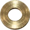 The Bezzera 5221837 Steam/Hot Water Valve Washer - D11 is a circular brass flat washer with a large central hole, smooth reflective finish, and visible concentric grooves. © 2025 1st-line.com