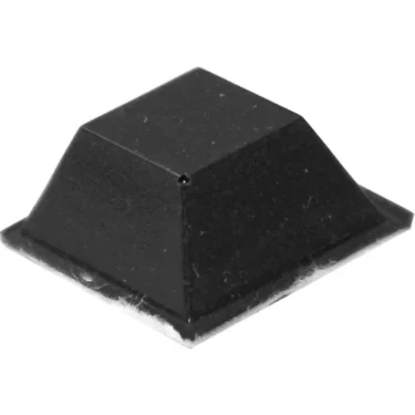 The Bezzera 7474217 Adhesive Foot/Leg is a small, black, square rubber bumper with a flat base and sloped top, ideal as a protective pad or leg for electronics or furniture. Suitable replacement for Bezzera 7474217. © 2025 1st-line.com