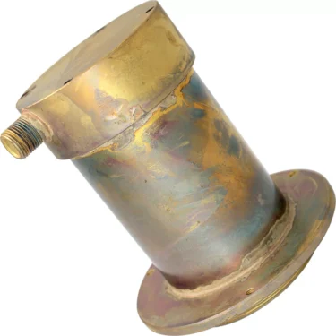 The Elektra 03387031 Cartridge Container is a cylindrical, weathered brass fitting with a round base and side nozzle, displayed at an angle on a white background. © 2025 1st-line.com