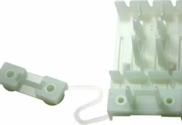 The Lelit MC025 Blocklead Terminal/Terminal Block Supporter PA228 is a white plastic holder with a detached cover, designed for two AA batteries side by side, featuring a small wire attached to the cover. © 2025 1st-line.com
