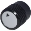 The Lelit MC334 Adjustment Knob is black and cylindrical with a ridged grip and a white top featuring a black outward-pointing triangular arrow. © 2025 1st-line.com