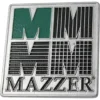 The Mazzer S000TAA02 Back Plate features a metallic badge with bold, stylized green and black MM lettering above MAZZER in capital letters. © 2025 1st-line.com