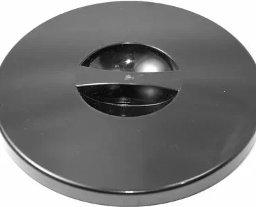 The Quamar 160149 Bean Hopper Lid is a round, black lid with a central raised dome and a horizontal bar across the middle, offering a sleek, minimalist look. © 2025 1st-line.com