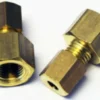 Two brass hexagonal Ascaso I..175 Boiler Fittings for Non-Professional Boilers with 4 holes are shown on a white background—one lying down to display the internal thread, the other upright and partially screwed together. © 2025 1st-line.com