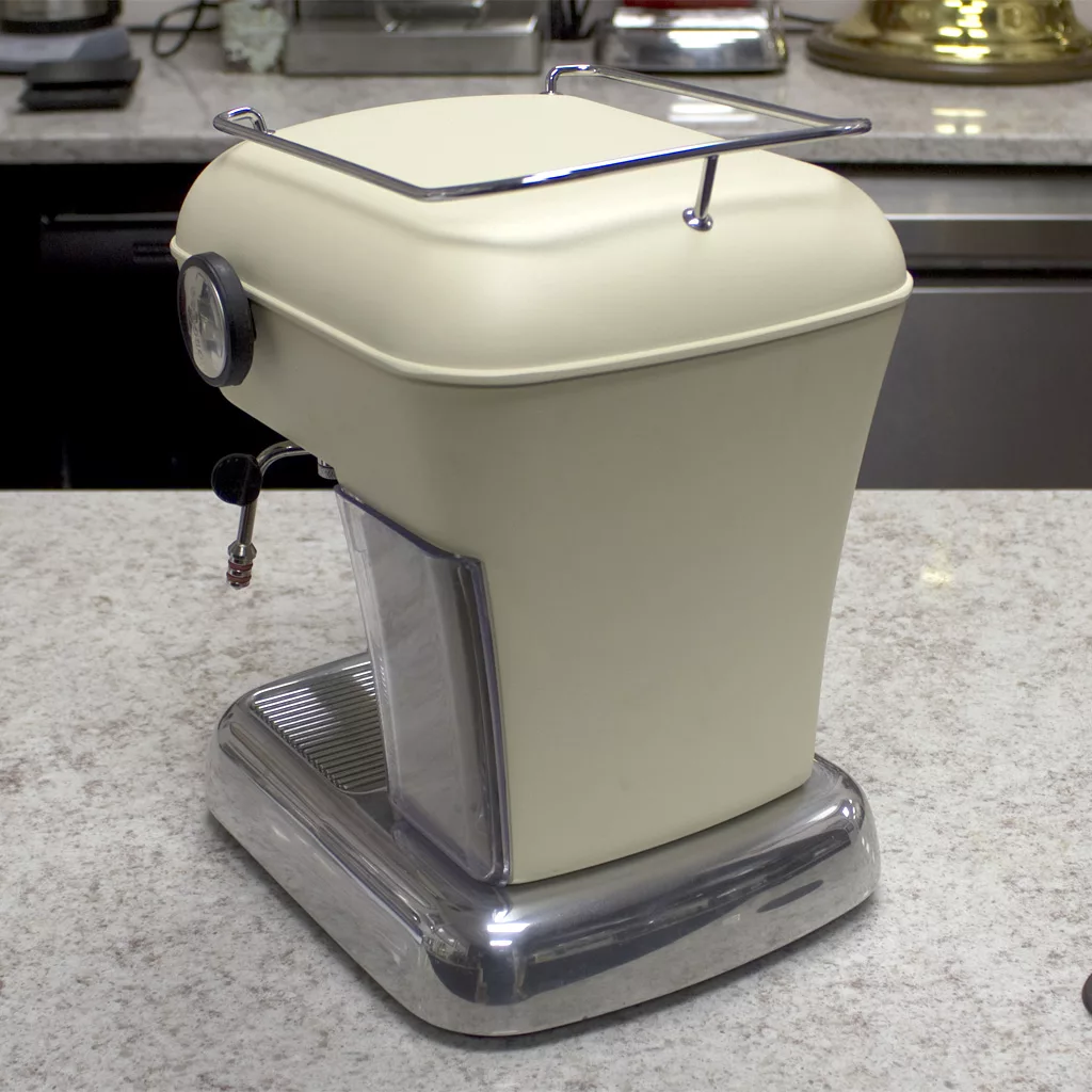 A SOLD Ascaso Dream V2 Sweet Cream Espresso Machine (returned & refurbished) with a chrome base, metallic top rail, and steam wand sits on the kitchen counter, set against a backdrop of softly blurred kitchen items. © 2025 1st-line.com