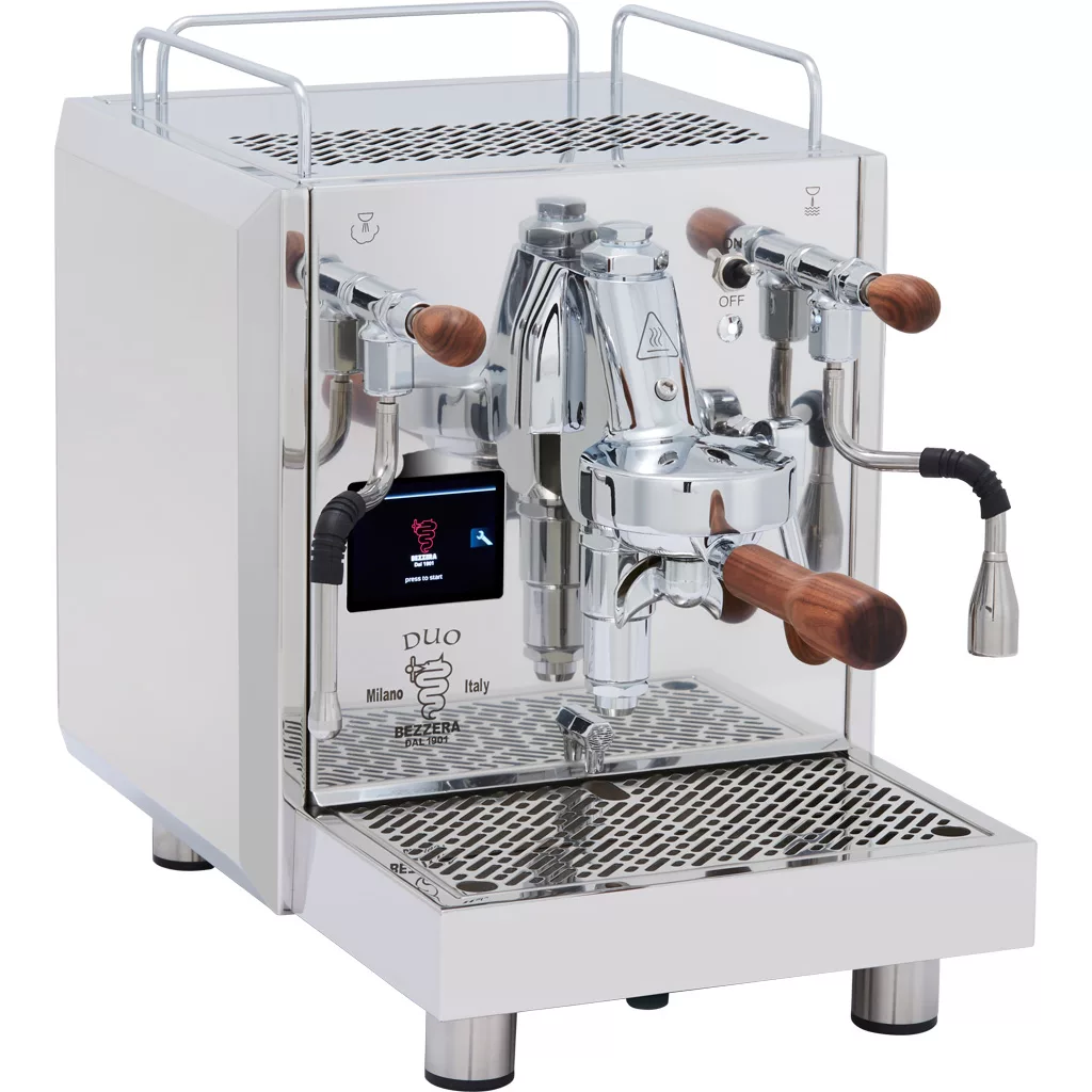 The Bezzera Duo MN V2 Dual Boiler Espresso Machine features stainless steel construction, wooden handles, a digital display, dual steam wands, and a metal drip tray in a modern, polished design that reflects its surroundings. © 2025 1st-line.com