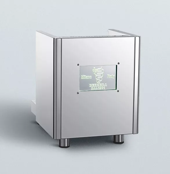 The Bezzera Mitica V2 HX Espresso Machine features a stainless steel body with a boxy design, four short legs, and a front panel that displays green text and a graphic logo on a plain light background. © 2025 1st-line.com