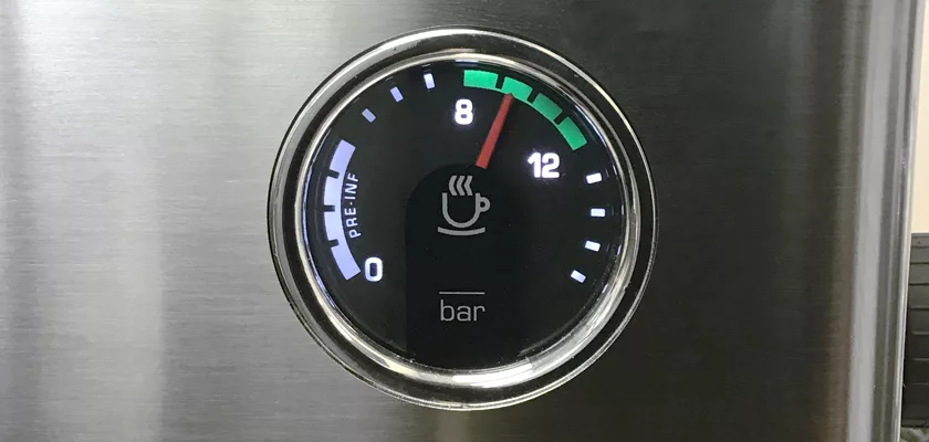 A close-up of a pressure gauge on the Lelit Elizabeth V3 Dual Boiler Espresso Machine, with the needle at 8 bar. The gauge displays black, white, green, and red markings and features a coffee cup icon in the center. © 2025 1st-line.com