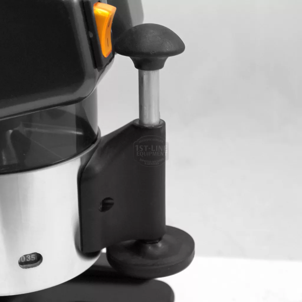 Close-up of the 1st-line Michael Espresso Coffee Grinder in black and silver, featuring a round black handle and yellow switch, set against a neutral background. © 2025 1st-line.com