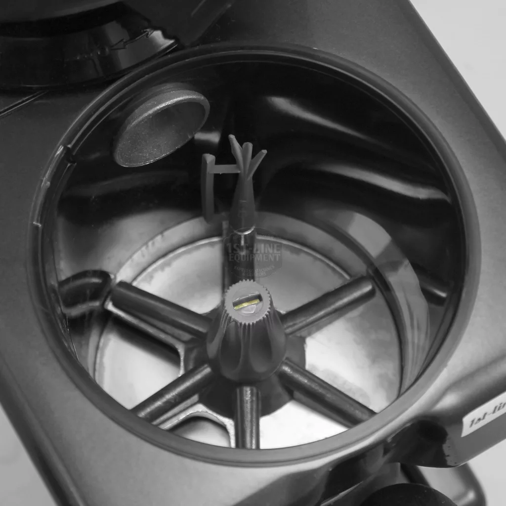 Close-up view inside the 1st-line Michael Espresso Coffee Grinder, showing a clean, empty chamber with a central rotating attachment featuring multiple arms on a circular base. © 2025 1st-line.com