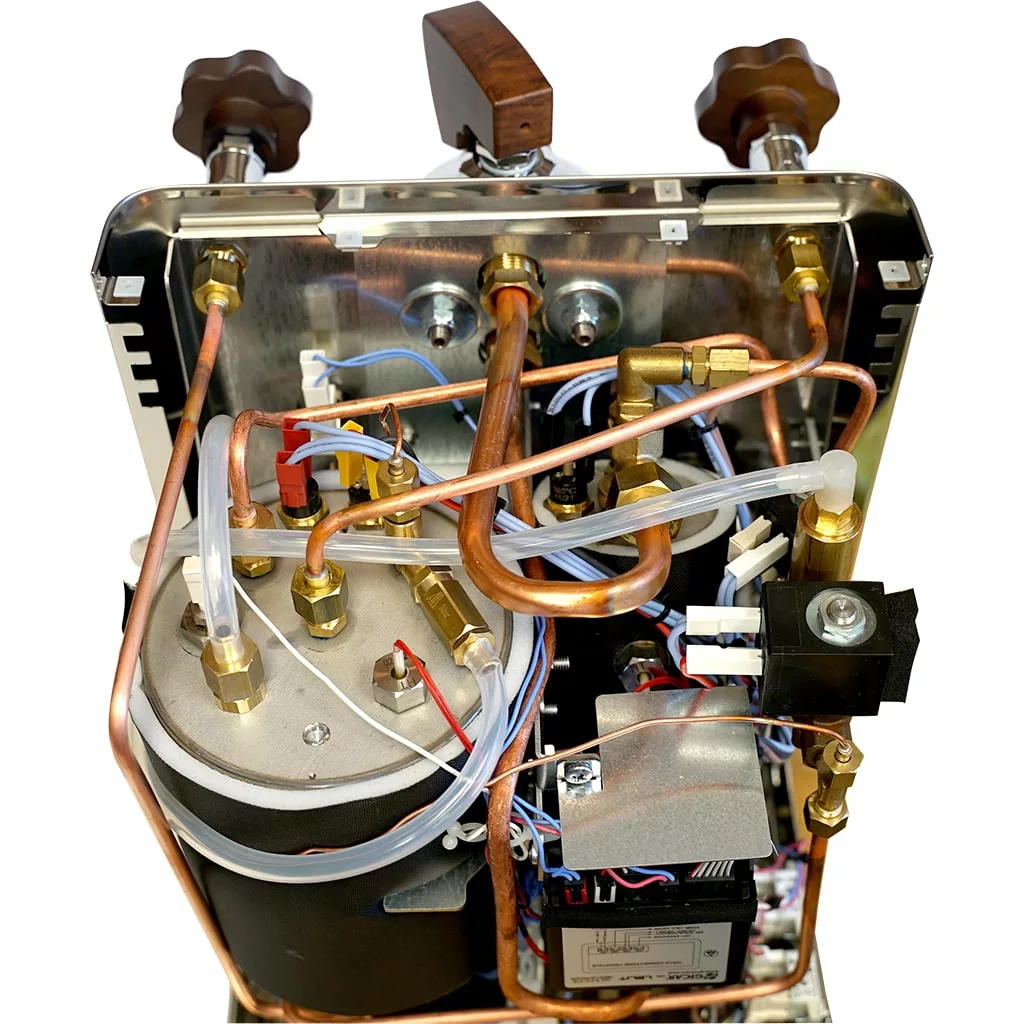 Top-down view of the Lelit Bianca V3 Dual Boiler Espresso Machine showing its internal layout with copper pipes, wires, valves, and a robust metal boiler housed in a durable metal casing. © 2025 1st-line.com