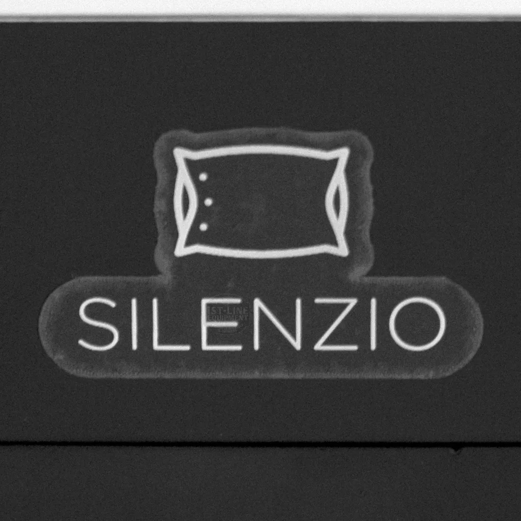 A black and white sign shows a simple pillow illustration above the bold word SILENZIO, referencing the quiet operation of the DISCONTINUED Eureka Mignon Silenzio 50mm Espresso Coffee Grinder. © 2025 1st-line.com