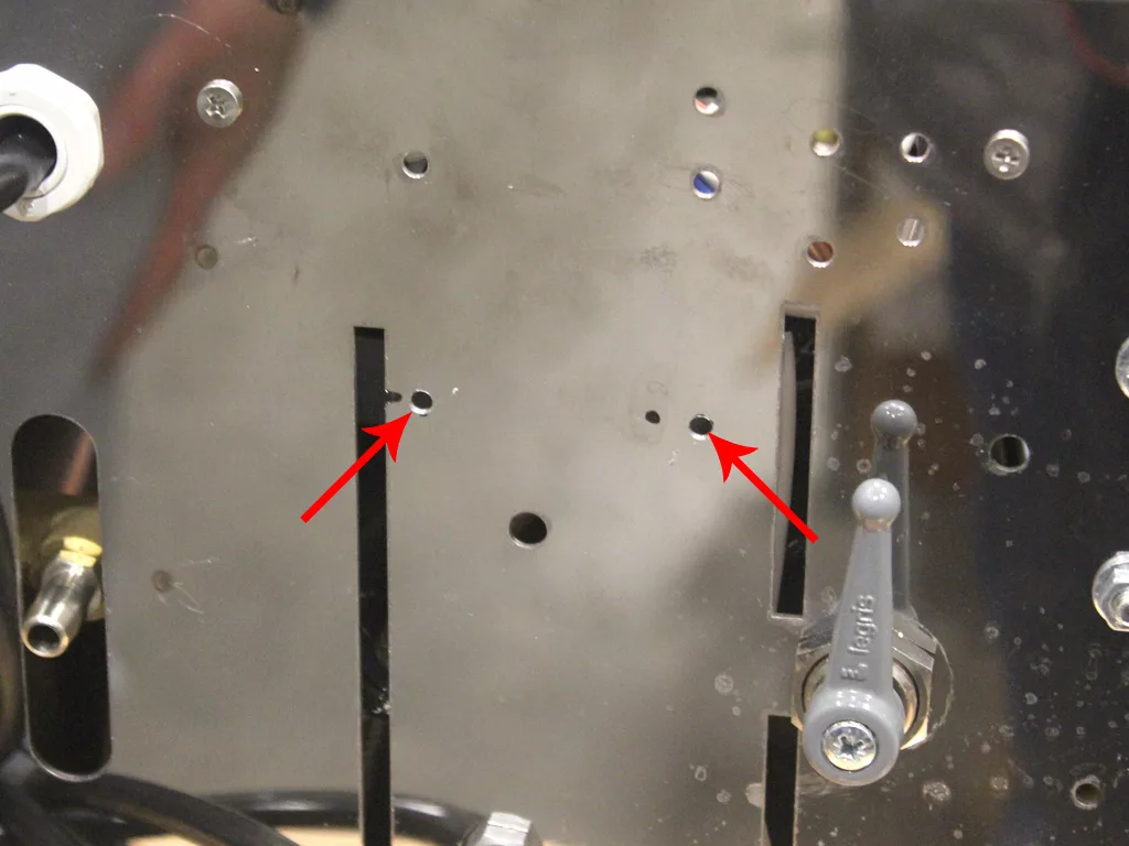 A close-up of a metal panel, compatible with VBM Dual Boiler 3.5 to 4.0 conversion, shows several holes and two red arrows pointing to small round openings. A gray lever marked PUSH is visible on the right side of the image. © 2025 1st-line.com
