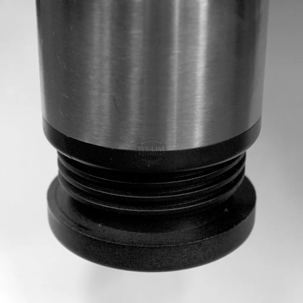 Close-up of a metal and black plastic threaded cylinder, likely part of the SOLD RETURNED AND REFURBISHED Ascaso Bar 2 Group Espresso Machine (110V, direct connect with vibration pumps), shown against a plain white background. © 2025 1st-line.com