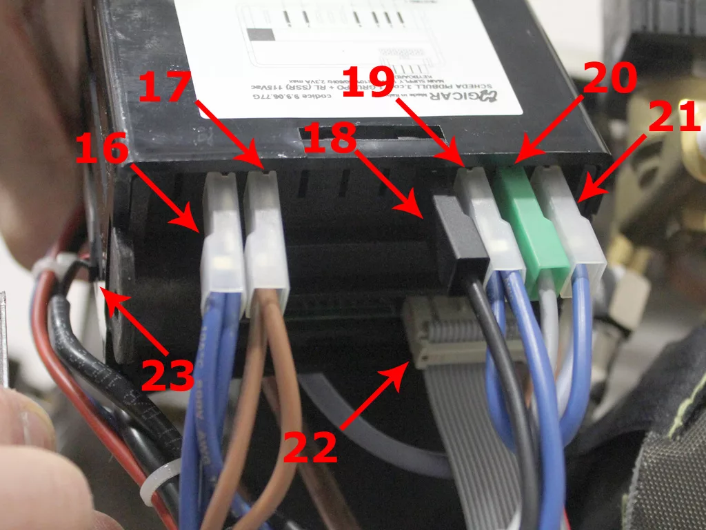 Close-up of an electronic device, possibly part of a VBM Dual Boiler, with several wires connected to numbered ports (16–23), each indicated by red arrows and labels above the connectors. © 2025 1st-line.com