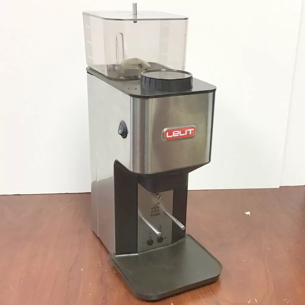 A SOLD Lelit PL71 William Espresso Coffee Grinder (returned & refurbished) with a clear bean hopper is displayed on a brown wooden surface against a plain white background. © 2025 1st-line.com