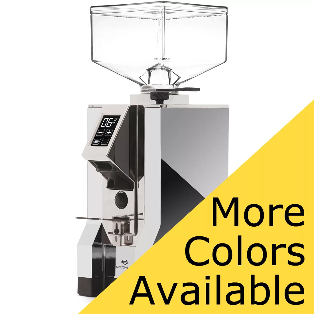 The Eureka Mignon Specialita Espresso Coffee Grinder is shown on a white background with a yellow diagonal banner reading More Colors Available in bold black text. It features a digital display and transparent bean hopper. © 2025 1st-line.com