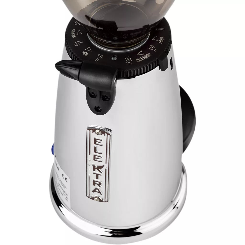 A close-up of the Elektra MSD Espresso Coffee Grinder showcases its metallic finish, precise grind size adjustment dial, and the distinctive Elektra nameplate on the front. © 2025 1st-line.com