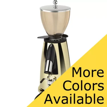 A shiny gold Elektra MSD Espresso Coffee Grinder with a clear hopper and metallic accents, partly obscured by a yellow triangle stating More Colors Available in bold black text. © 2025 1st-line.com