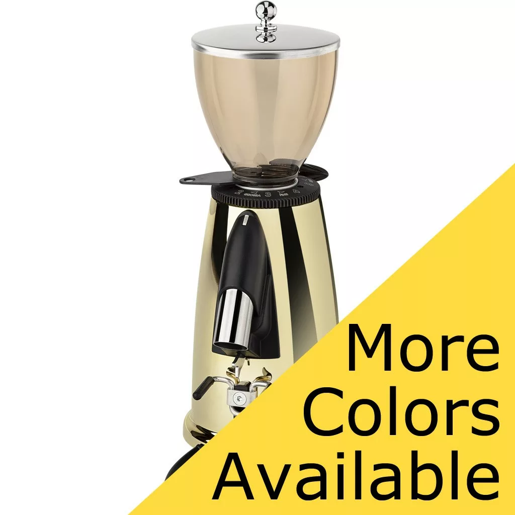 A shiny gold Elektra MSD Espresso Coffee Grinder with a clear hopper and metallic accents, partly obscured by a yellow triangle stating More Colors Available in bold black text. © 2025 1st-line.com