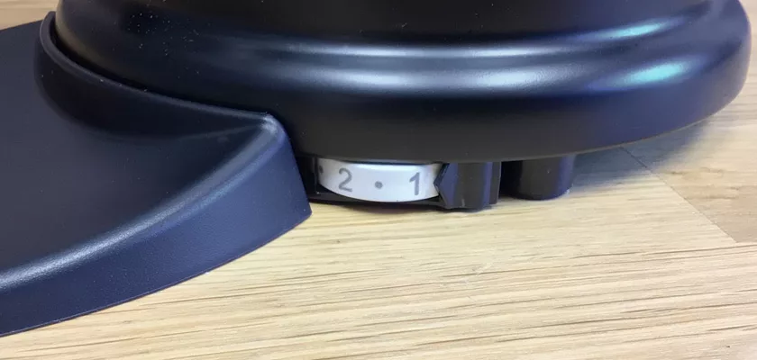 Close-up of the Elektra MSD Espresso Coffee Grinder on a wooden surface, highlighting its rotating dial set to 2 and 1. The dial, partly enclosed by the base, exemplifies this high-quality coffee accessory. © 2025 1st-line.com