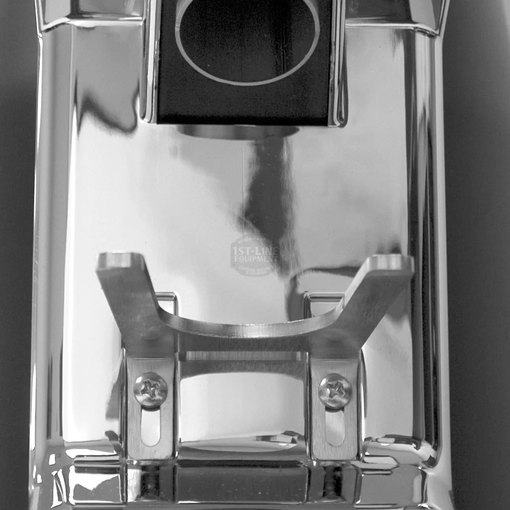 Close-up view of a shiny metallic espresso machine portafilter holder with visible screws and a slot for the portafilter handle, positioned beside a 1st-line Don Vito Espresso Coffee Grinder. © 2025 1st-line.com