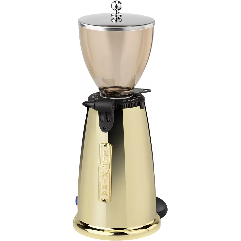 The Elektra MSD Espresso Coffee Grinder features a gold finish, a transparent bean hopper with a shiny metallic lid, and is displayed against a white background. © 2025 1st-line.com
