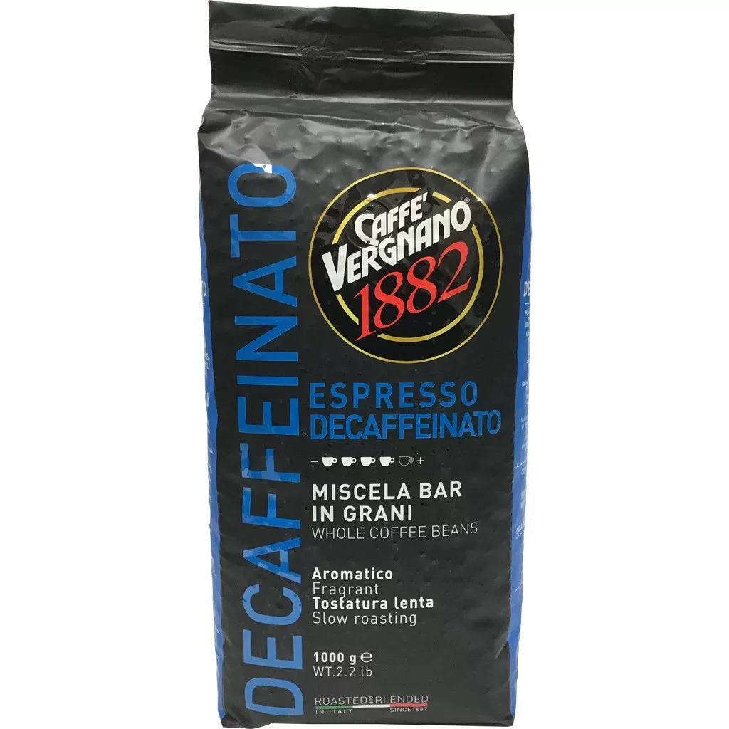 A black 1 kg (2.2 lbs) bag of Caffe’ Vergnano Espresso Decaffeinato Whole Coffee Beans with blue accents, bold DECAFFEINATO text, and details in Italian and English on the packaging. © 2025 1st-line.com