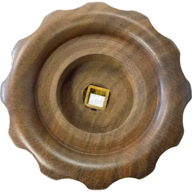 The 1st-line Steam / Hot Water Knob features a round wooden design with wavy edges and a square golden-brown stone center, showcasing visible wood grain for a rustic, handcrafted look. © 2025 1st-line.com