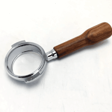 A Bezzera 5965635R E61 Wood Handle 58mm Bottomless Portafilter, empty and viewed from above at a slight angle, rests on a white surface. © 2025 1st-line.com