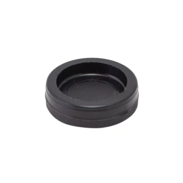 The Lelit 3700012 Steam/Hot Water Knob Cover, a small round black plastic piece with slightly raised edges, is pictured against a plain white background. © 2025 1st-line.com