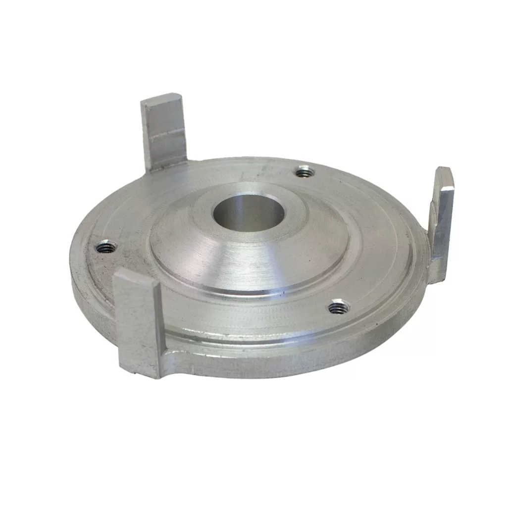 The Quamar Rotating Burr Holder-T48 is a round silver metal part with a central hole, three evenly spaced raised rectangular tabs on the edge, and three screw holes on the flat surface—designed for use with the Quamar T48. © 2025 1st-line.com