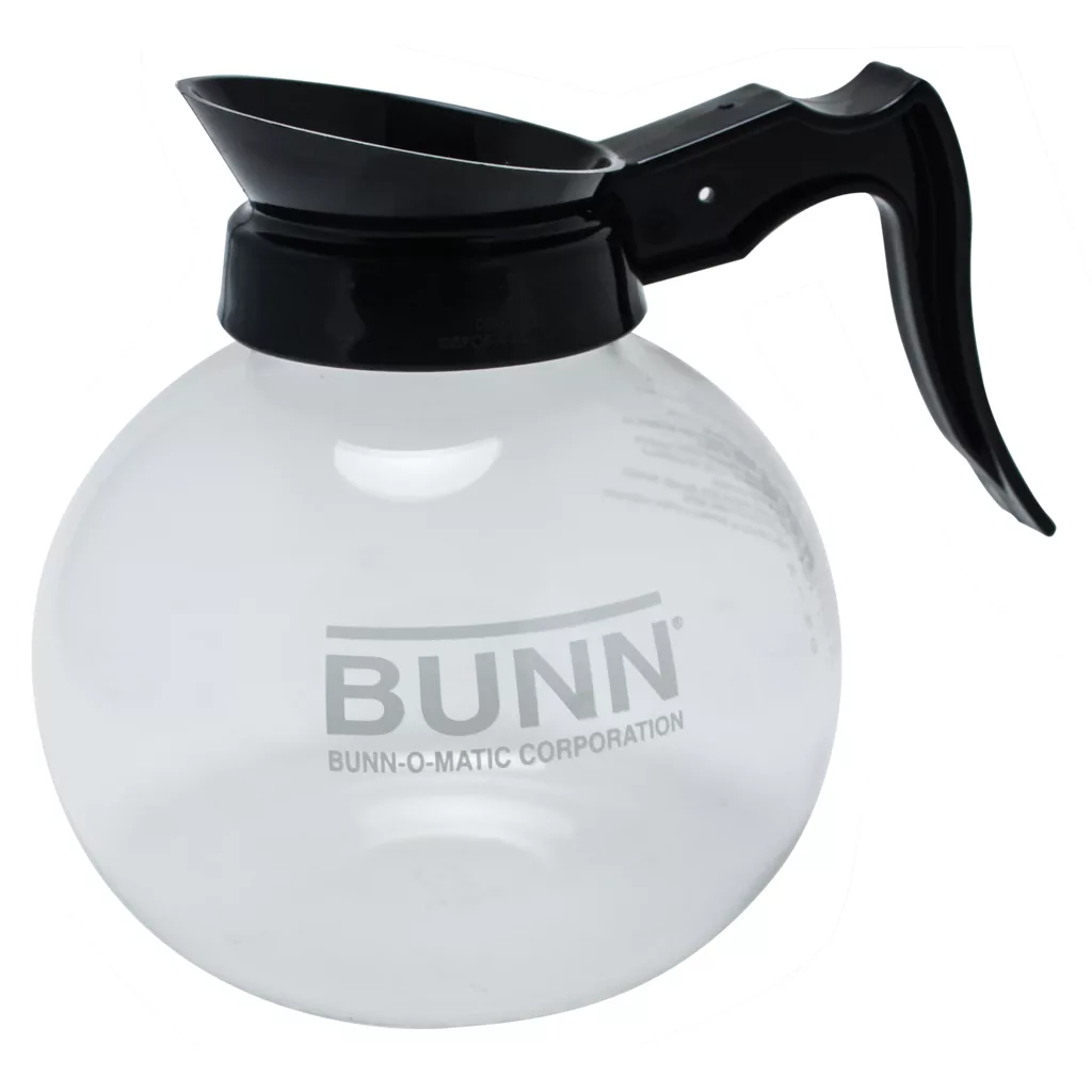 The Bunn Glass Coffee Decanter, 12 cup, 64 oz., features a clear glass body with black handle and spout, BUNN logo on the side, and is shown empty against a white background. © 2025 1st-line.com