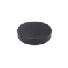 A black, round hockey puck sits on a white background. © 2025 1st-line.com