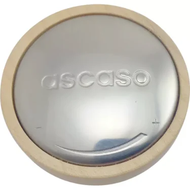 The Ascaso PM.425 Maple Wood Steam Knob features a round, shiny silver metal center engraved with ascaso, a light maple wood rim, and etched details including a plus sign and curved line near the edge. © 2025 1st-line.com
