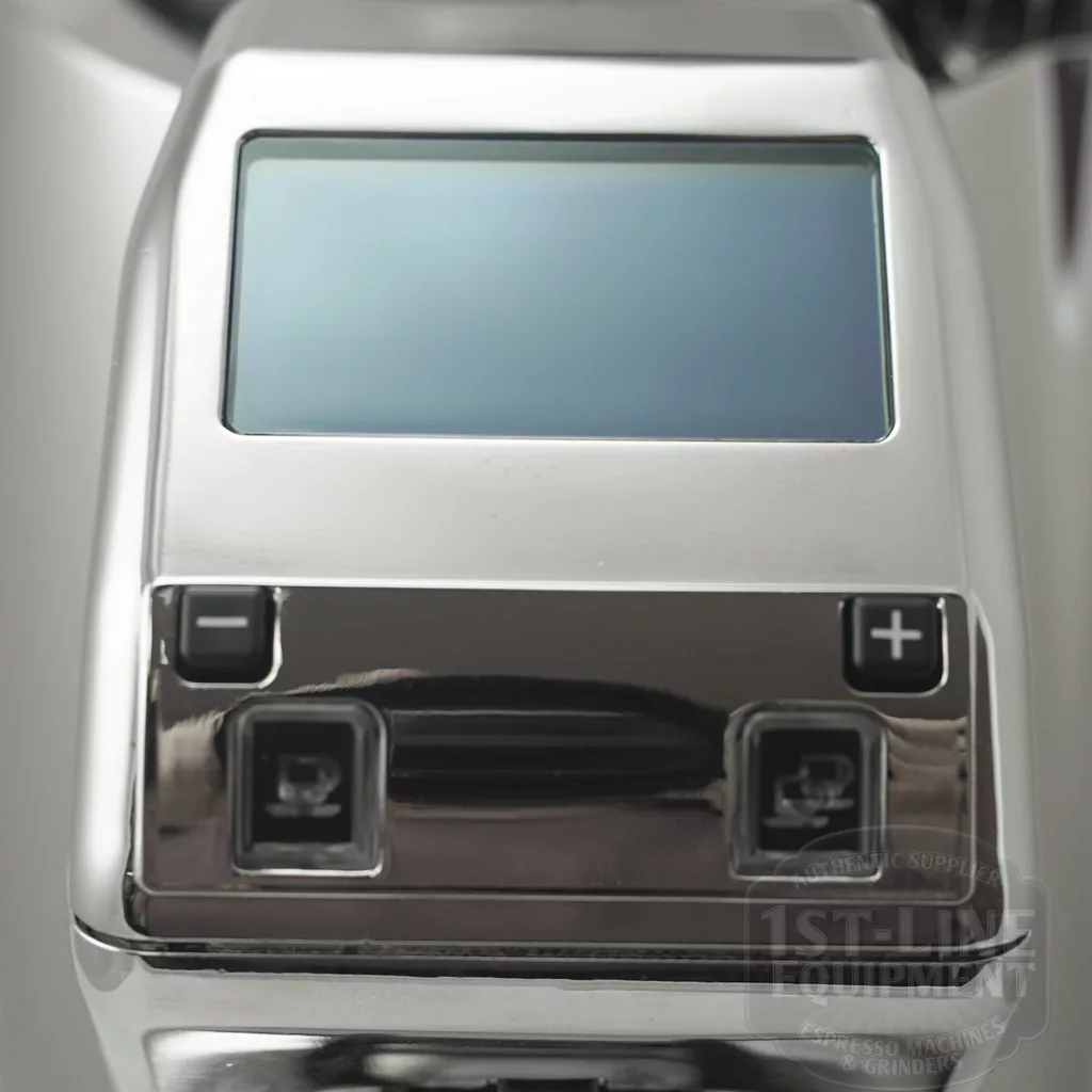 Close-up of the DISCONTINUED Eureka Zenith 65 E Espresso Coffee Grinder – Steel Burrs, Tall Bean Hopper, highlighting its metallic control panel with a rectangular digital screen, two square plus/minus buttons below and arrow buttons on each side. © 2025 1st-line.com