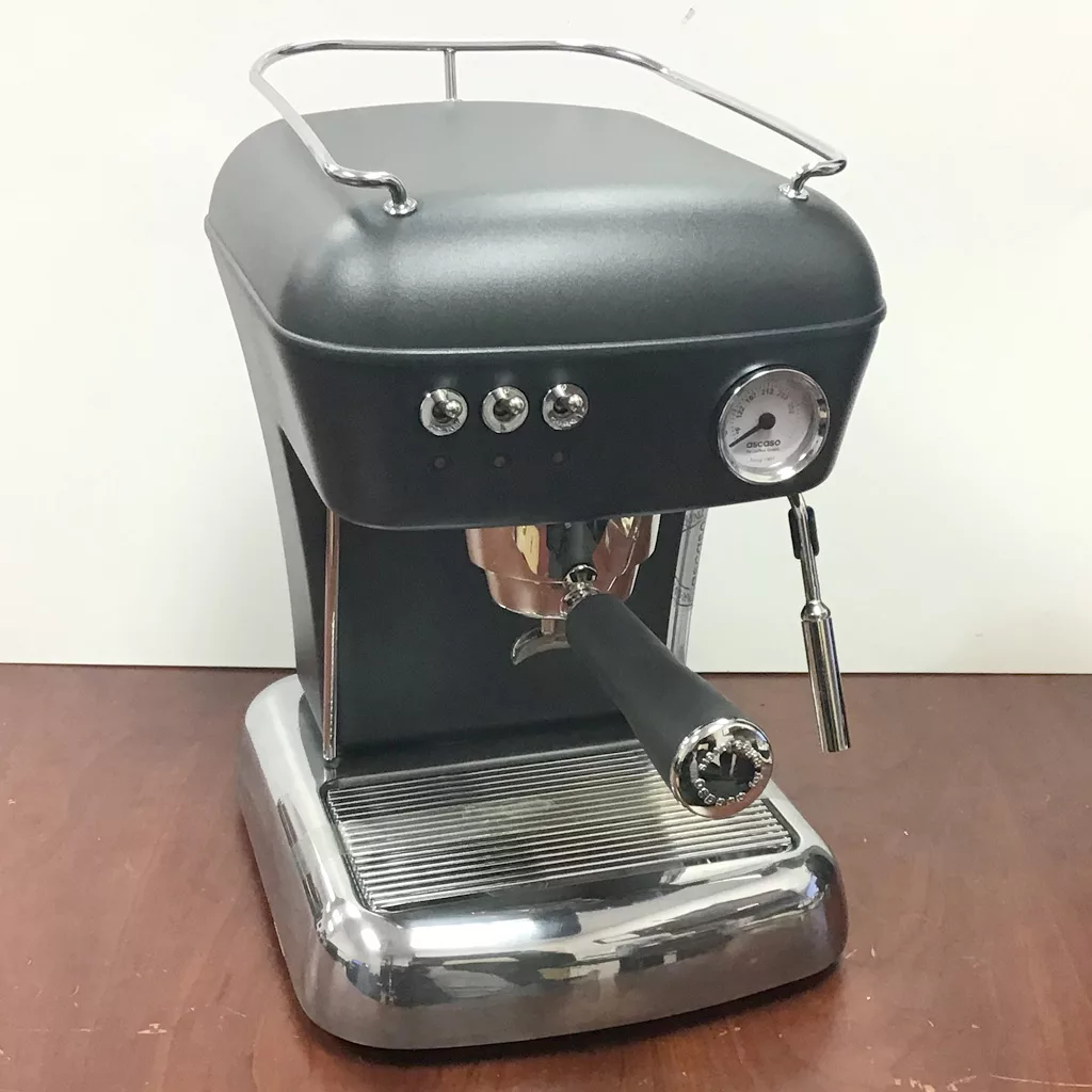 A refurbished SOLD Ascaso Dream Anthracite Gray Espresso Machine (boiler version) with three buttons, pressure gauge, steam wand, and portafilter is displayed on a wooden surface. © 2025 1st-line.com