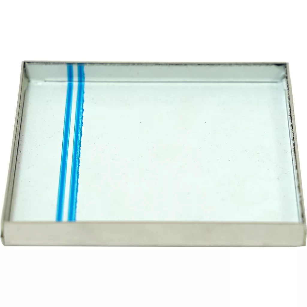 The Lelit MC305 Grinds Catch Tray is a rectangular glass plate with a metal frame and a single blue vertical line near the left edge, designed as an accessory for Lelit coffee machines. © 2025 1st-line.com
