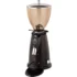 A black Elektra MXD digital espresso grinder with a large transparent bean hopper, coffee dispensing spout, control buttons, and a circular base. This coffee grinder is designed for convenient countertop use. © 2025 1st-line.com