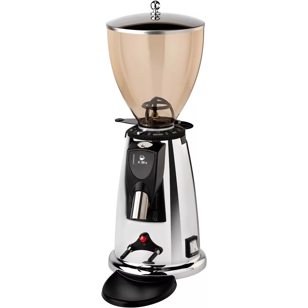 A shiny, chrome Elektra MXD coffee grinder features a large, translucent bean hopper on top, a digital display, and a spout for dispensing ground coffee. The base includes a black tray for catching excess grounds. © 2025 1st-line.com