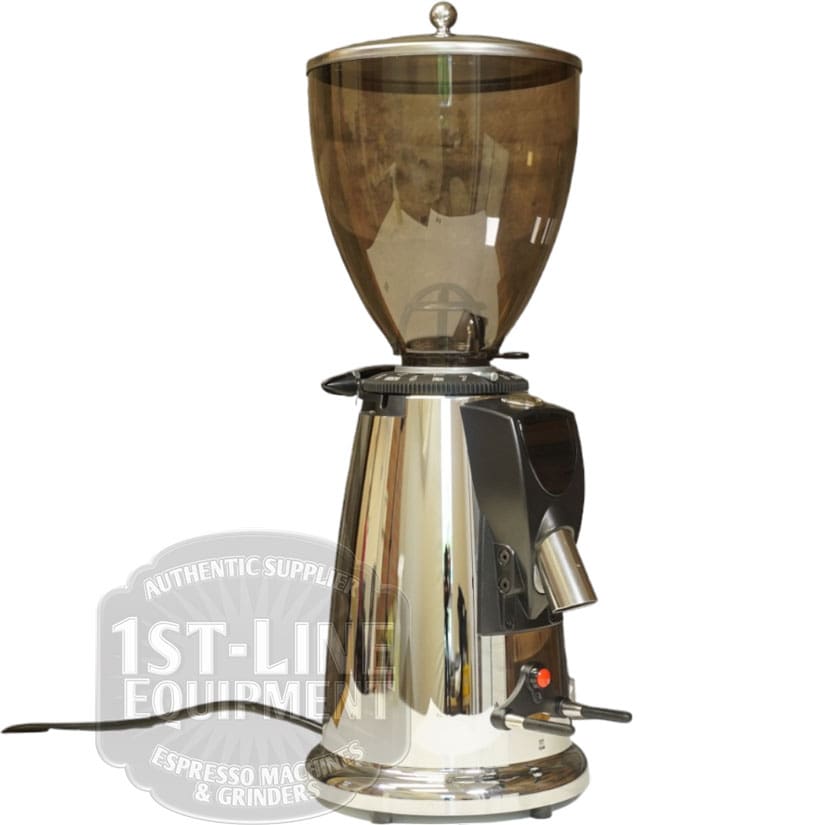 The Elektra MXD Maxi Digital Espresso Coffee Grinder has a shiny stainless steel body, a large translucent brown bean hopper, a ground coffee spout, convenient control switches at the base, and displays the 1st-Line Equipment logo. © 2025 1st-line.com