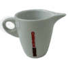 The Kimbo 900382 Small Porcelain Milk Pitcher - 2 oz features a handle, spout, and “KIMBO” in red on the side. Ideal as an espresso creamer or for serving milk with coffee or tea. © 2025 1st-line.com